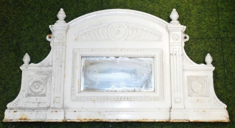 A late 19thC cast metal mirror surround, with small rectangular mirror plate on scroll floral and column supports, painter white, 86cm wide, 46cm high.