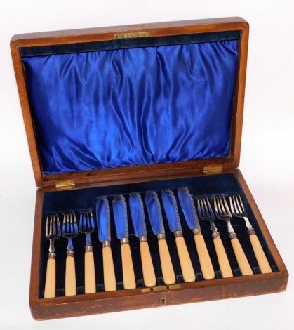 A set of fish knife and forks, with bone handles and silver tops bearing makers stamp JAS, in a walnut and blue velvet lined fitted box, 33cm wide.