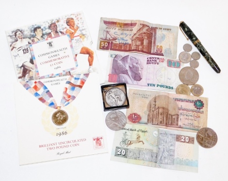 Various coins, notes and ephemera, to include the Commonwealth Games commemorative two pound coin 1986, in case, a silver sporting medallion, fountain pen, foreign notes, etc.