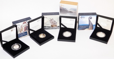 Four Royal Mint cased collectors coins, to include New Horizons, 1066 The Date That Made History, Viking Conqueror English King, and William Wordsworth, boxed.