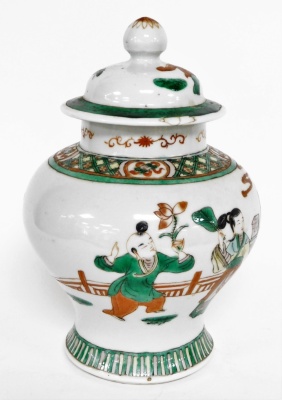 A Chinese ginger jar and cover, heavily decorated with green and red borders, and figures under trees, with character stamp to underside, 23cm high. - 4