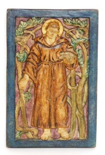 A Compton pottery plaque of a religious figure, in blue border Compton pottery stamp to reverse, 17cm x 11cm.