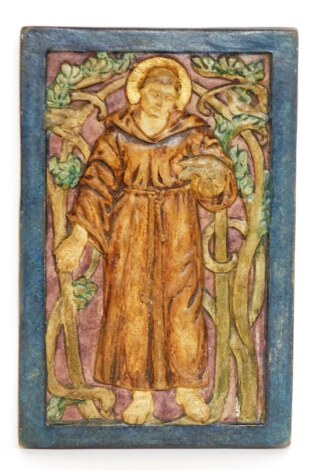 A Compton pottery plaque of a religious figure, in blue border Compton pottery stamp to reverse, 17cm x 11cm.