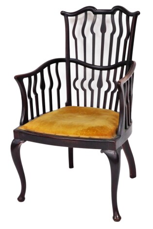 A late 19thC mahogany side chair, with shaped arms and pierced back, on mustard upholstered seat, 95cm high, 52cm deep.