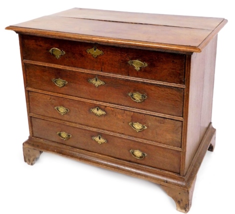 An oak four drawer chest, with brass handle and key plates, 80cm high, 96cm wide, 61cm deep.