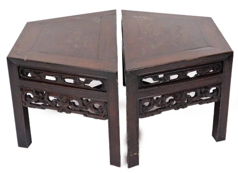A pair of Chinese hardwood low tables, each with a pierced and carved double frieze, on square section legs, 44cm high, 88cm wide, 47cm deep.