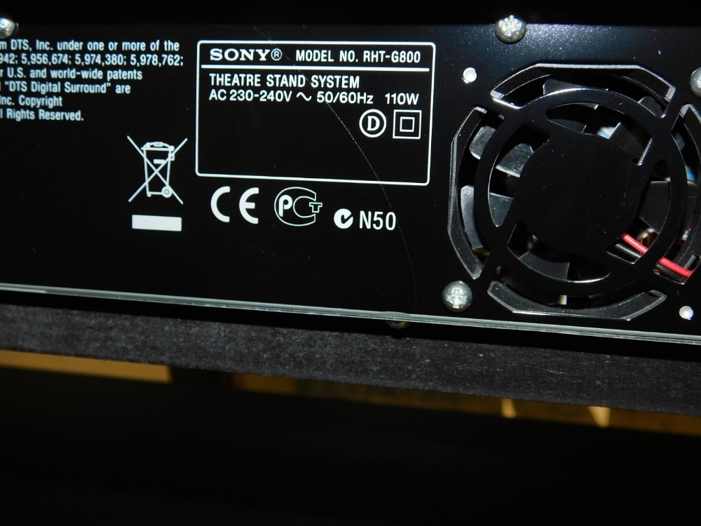 A black glass Sony RHT-G800 theatre stand system hifi, with a
