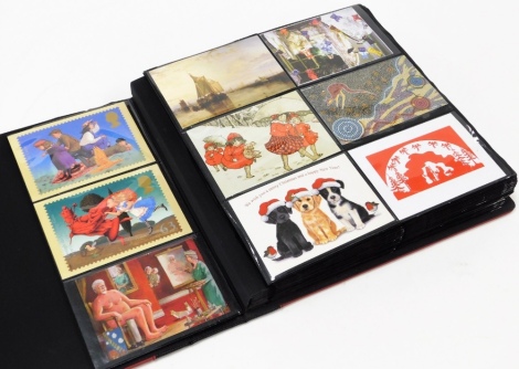 An album of postcards, depicting the seasons and collectors scenes, mainly in colour and modern. (a quantity)