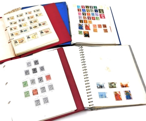 Four albums of world used stamps, to include mainly UK and European stamps. (a quantity)