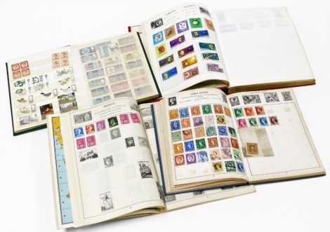 Four stamp albums, to include The Strand stamp album with world used stamps, for Great Britain, Europe and America, a further album of used bird and other stamps, an Improved Postage stamp album, world stamp book, and an All Nations stamp album with some 