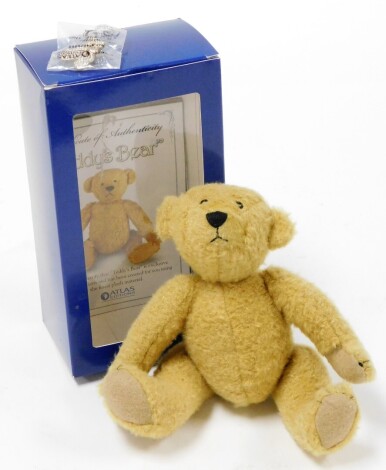 An Atlas Editions teddy bear, with collectors pin badge from The Heritage Collection with certificate of authenticity, boxed, 20cm high.