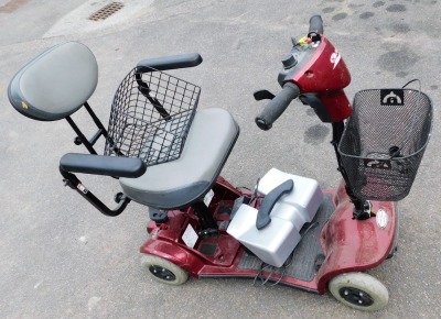 A Protec Mobility Kymco red mobility scooter.