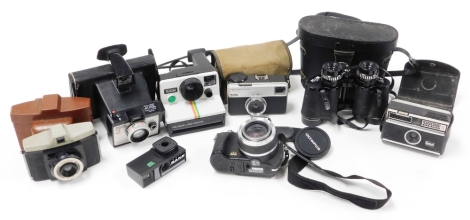 Various cameras and binoculars, to include an Olympus modern camera, a Kodak Instamatic 33, a Polaroid, various flashes, set of binoculars, etc. (a quantity)