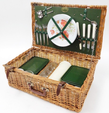 An Optima wicker picnic hamper, with floral plastic plates, flasks and lunch boxes, the basket 57cm x 35cm.