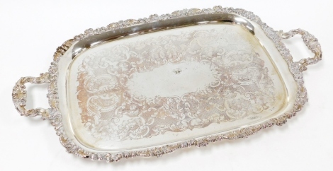 A silver plated galleried tray, with heavy scroll rococo decoration, 71cm x 42cm.