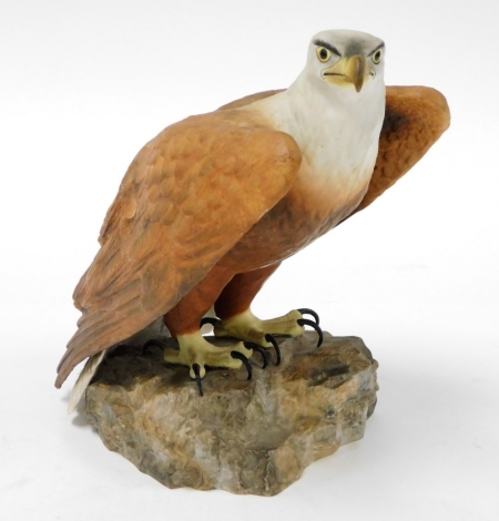 A Royal Crown Derby eagle, perched on a rock with green Royal Crown Derby stamp to underside, 26cm high.