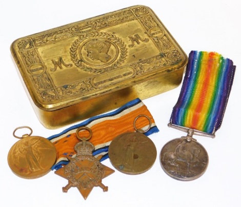 A set of WWI medals, named Pte V Powell, Grenadier Guards, 13699, comprising 1914-15 star, Victory and War Medals, together with a Victory Medal named for Pte H Burton, South Staffordshire Regiment, 40432, and a Princess Mary brass Christmas tin 1914.