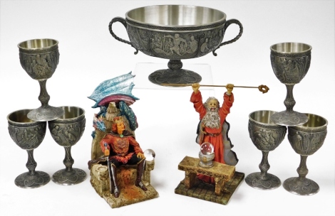 A Franklin mint The Excalibur Legends of Camelot bowl, and six associated goblets, together with two Arthurian figures.