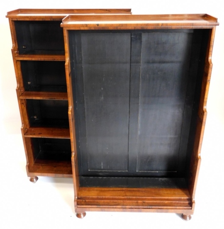 A pair of 19thC rosewood waterfall open bookcases, each with a raised gallery above three shelves, shelves on bun feet, 127cm high, 79cm wide, 30cm deep. Auctioneer announce each bookcase has one side not veneered and painted. 