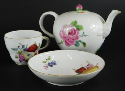 A 19thC Meissen porcelain bullet shaped teapot, decorated with flowers, etc., Marcolini period mark to underside, and a similar cup and saucer decorated with fruit, etc. (2)