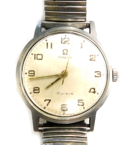 An Omega Geneve wristwatch, with silvered dial with gold hands, on expanding stainless steel bracelet, the watch head 3cm wide.