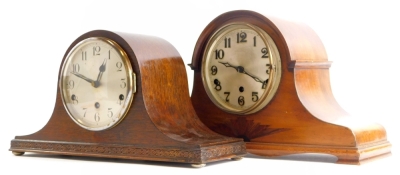 A 1920s/30s mahogany cased mantel clock, with silver dial and Westminster chime, the case inlaid with a fan, etc., 43cm wide, and an oak cased mantel clock with Westminster chime.