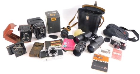 Miscellaneous items, to include a Russian Lomo camera, a Pentacon lens, binoculars, cameras, etc.