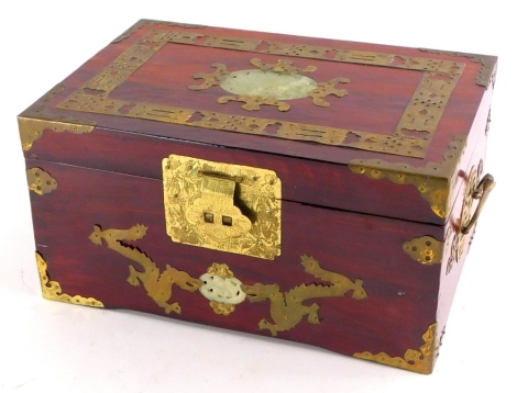 An oriental jewellery box, with brass borders inset with a green coloured stone, 31cm wide.