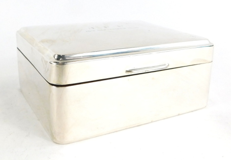 An Elizabeth II silver cigarette box, engraved to top JFF 18th September 1963, Birmingham 1961, 4.5cm high, 10cm wide, 8.5cm deep.