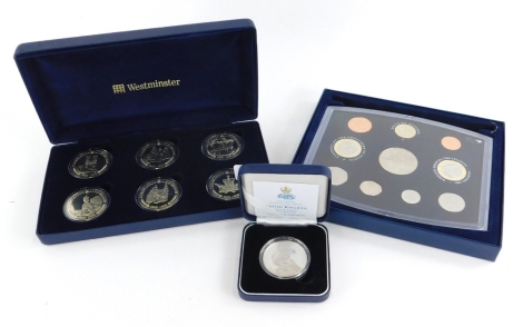 A United Kingdom silver proof Golden Wedding Anniversary five pound coin, issued by Coningsby International, a 2001 coin set and a Westminster Mint Royal Family Commemorative Coin Collection, containing copper nickel crowns 1993.