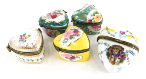 A collection of five Limoges and other continental porcelain heart shaped boxes and covers, each with gilt metal mounts.