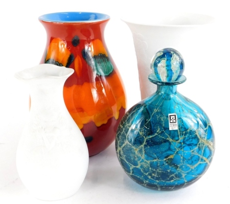 A Mdina glass bottle and stopper, with typical mottled decoration and paper label, 19cm high, a Poole pottery Delphis type vase and two Kaiser bisque porcelain vases. (4)