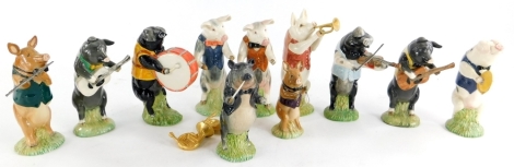 A collection of Beswick pig figures, each playing a musical instrument, to include Richard, Benjamin, Matthew, etc. (11)