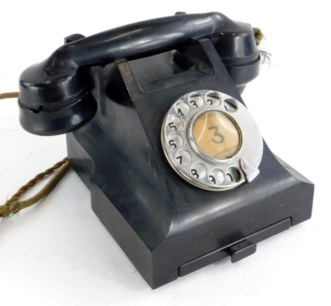 A vintage black Bakelite telephone, stamped to underside 4509B. (AF)