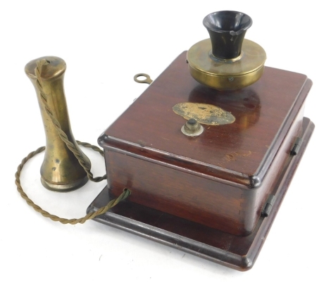 An early 20thC vintage telephone, with brass and black Bakelite mouth piece, brass handset and mahogany casing, indistinct label, the handset stamped G.13, 235,NO1. (AF)