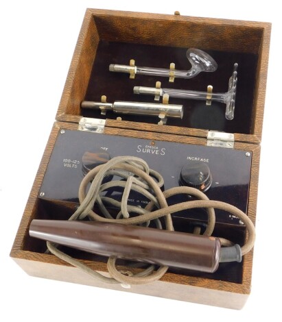 A Surves Efesca Bakelite electric shock treatment, in brown canvas case, with some fittings, etc., 26cm wide.