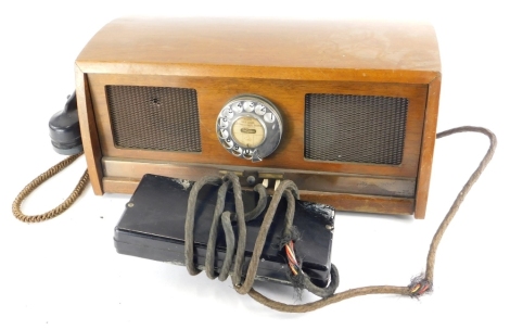 An Inter-Auto telephone, with black Bakelite receiver, stamped to underside serial number 1193, March 18th 1959, in a walnut case, 43cm wide.