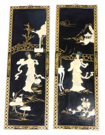 A pair of oriental lacquer panels, each with carved shell decoration of figures within a courtyard, with building and lilies, 91cm high.