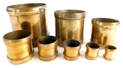 A set of grain measures, stamped Manufacturers The Oriental Metal Pressing Works Bombay, the largest stamped, 14cm high.