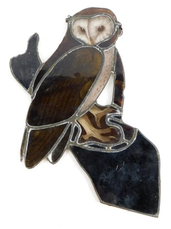 A stained glass panel, decorated in the form of an owl.