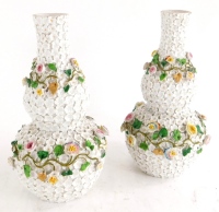A pair of continental porcelain double gourd shaped vases, each with flower encrusted decoration, blue anchor mark to underside, 22cm high.