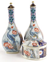 A pair of Vista Elegre porcelain vases, each decorated in the oriental style with birds, flowers, leaves, etc., 31cm high, and a similar box and cover. (3)