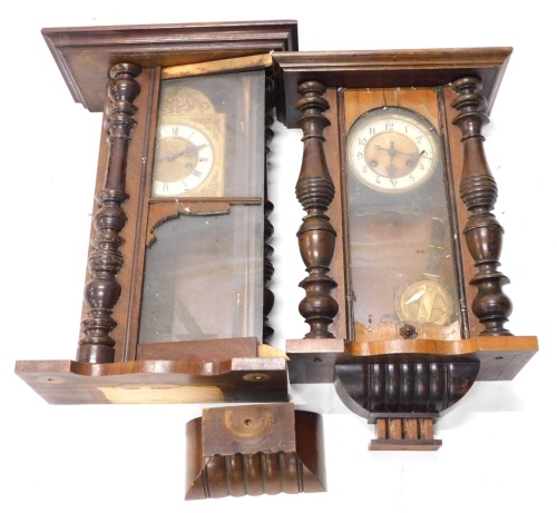 Two late 19th/early 20thC walnut Vienna type wall clocks, each with enamel decoration to the dial, part turned pilasters, etc. (AF)