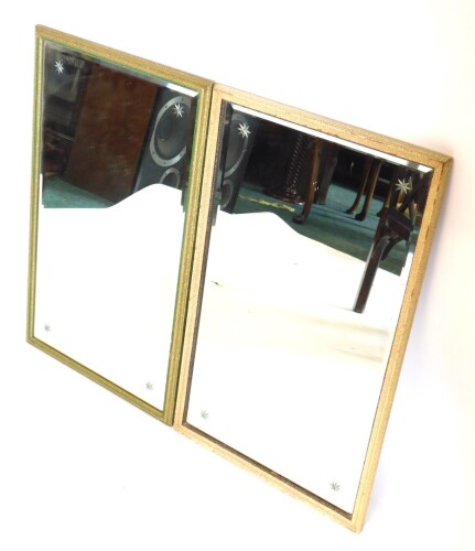 A pair of mottled gilt gesso wall mirrors, each with bevelled glass engraved with stars, 69cm high, 42cm wide overall.