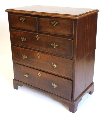 An early 19thC oak chest of drawers, the top with a moulded edge above two short and three long drawers, each with drop brass handles and bracket feet, in two sections, 89cm wide.