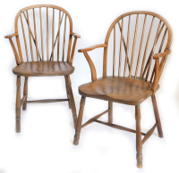 Two similar 19thC ash and elm Windsor chairs, each with a shaped back, spindle turned supports, a solid seat and shaped arms, on turned legs with H stretcher.