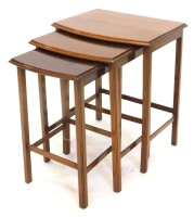 A nest of three mahogany D shaped tables, each with a moulded edge and plain supports, the largest 43cm high.