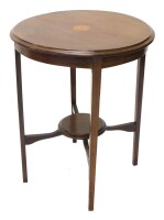 An Edwardian mahogany and boxwood strung occasional table, the circular top with a central inlaid patera, on square tapering legs with under tiers, 57cm diameter.