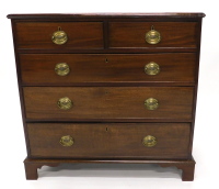 A 19thC mahogany chest of drawers, the top with a moulded edge above two short and three long drawers, each with oval brass handles, on bracket feet, 93cm wide.