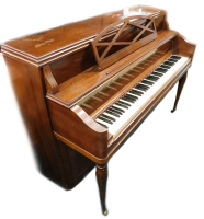 A Heintzman upright grand piano, in a walnut case, with simulated ivory keys, on baluster turned legs with castors, 107cm high, 145cm wide.